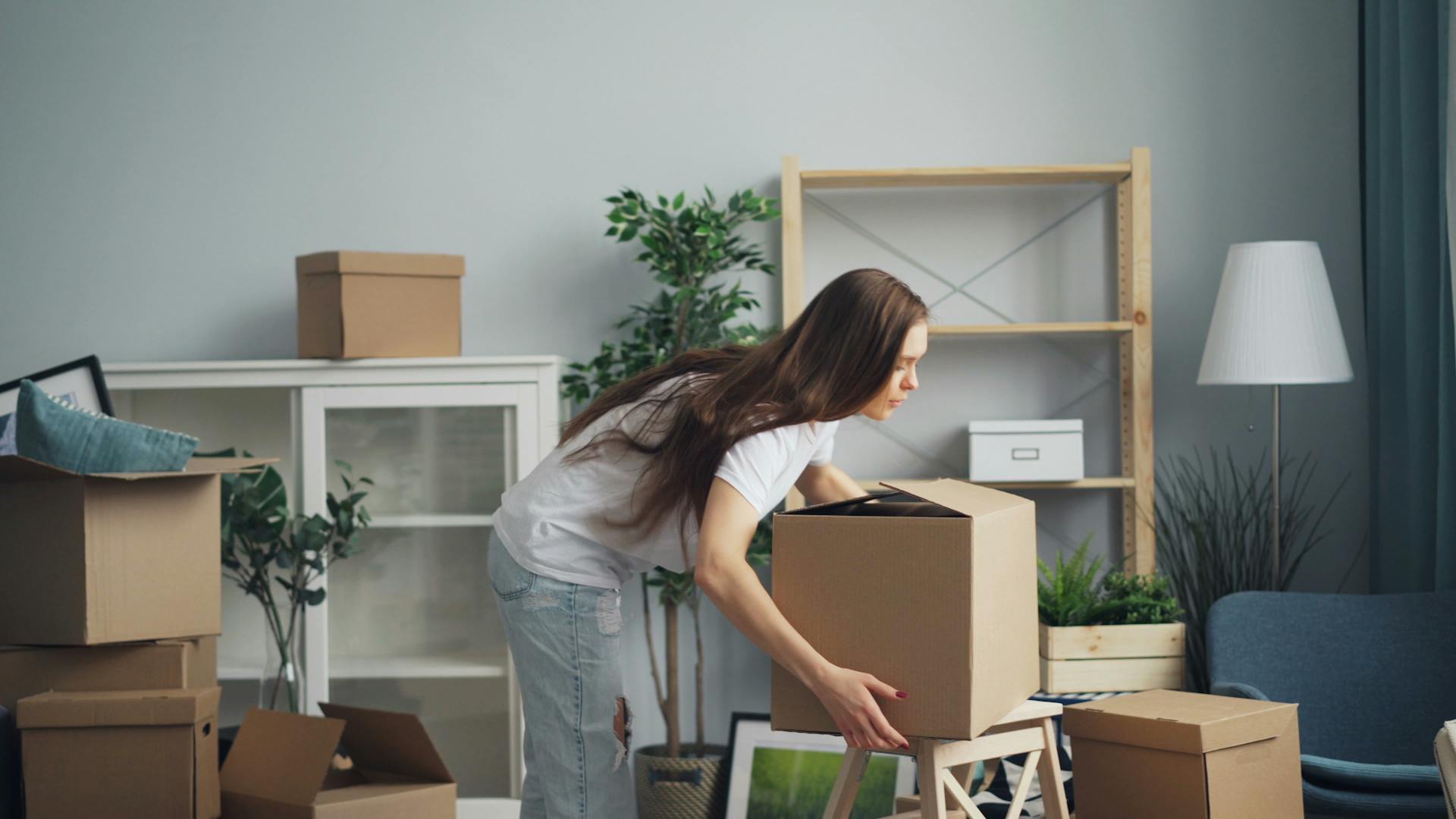 Woman staging and styling a home with furnishings